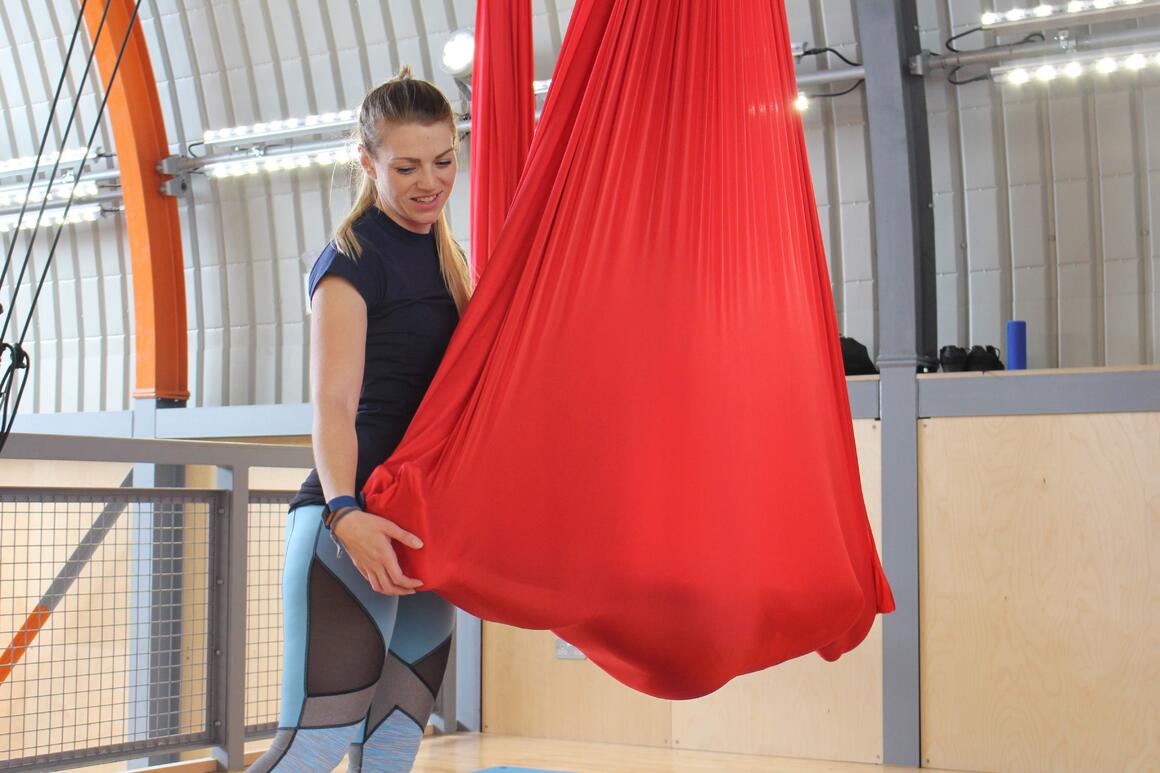 Student Relaxing in Aerial Yoga 