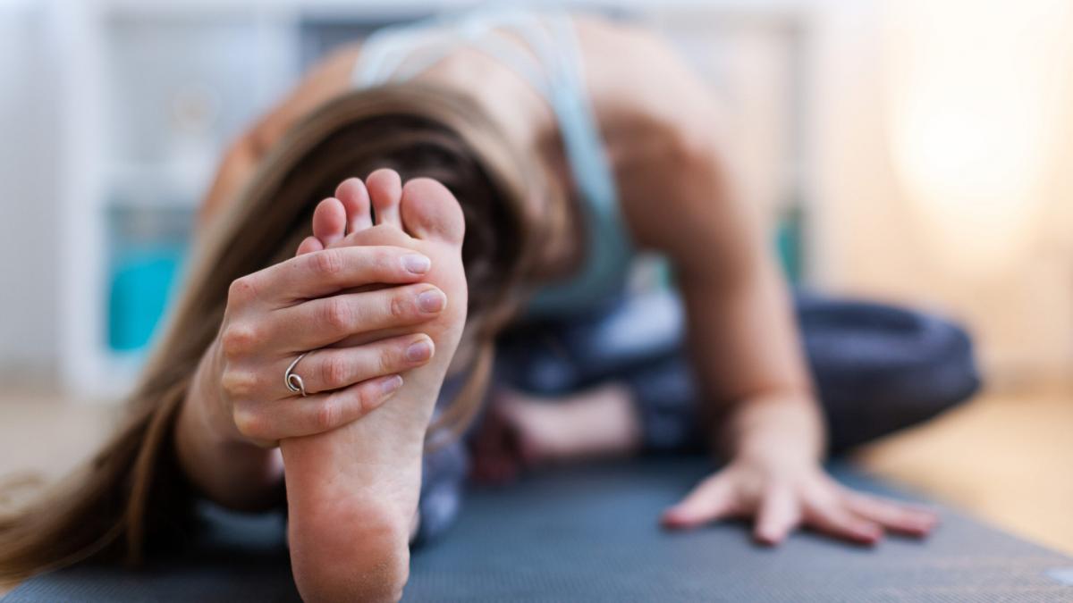 Stretching fold while holding foot
